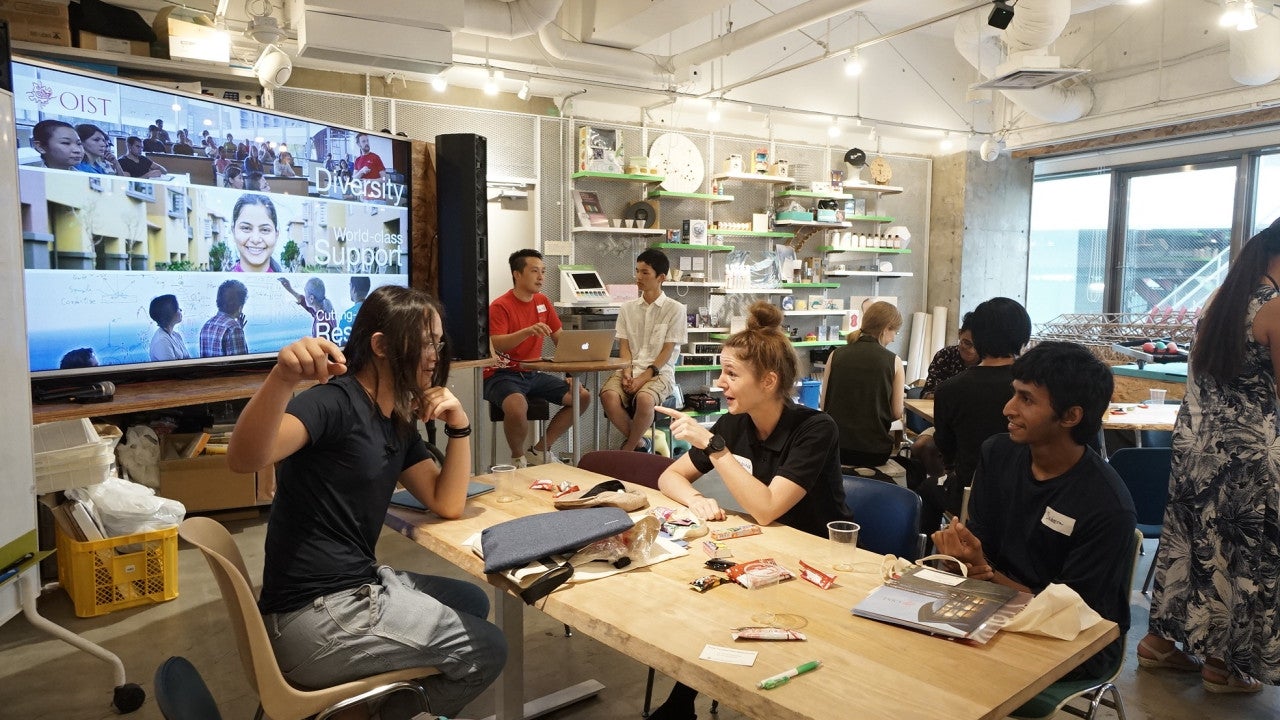 Students sitting around a table in a cafe