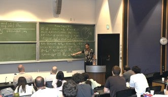 Prof. Ugur Abdulla presents a lecture on the first day of the OIST-Oxford-SLMath Summer School 2024