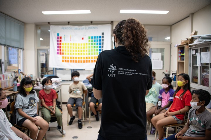 elementary school children listening to OIST scientist in the classroom