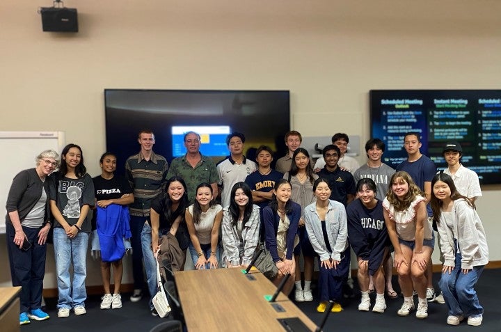 Group photo of students and a lecturer