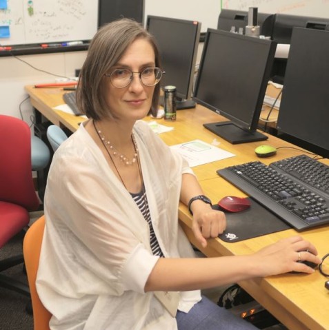 A woman sitting in an office