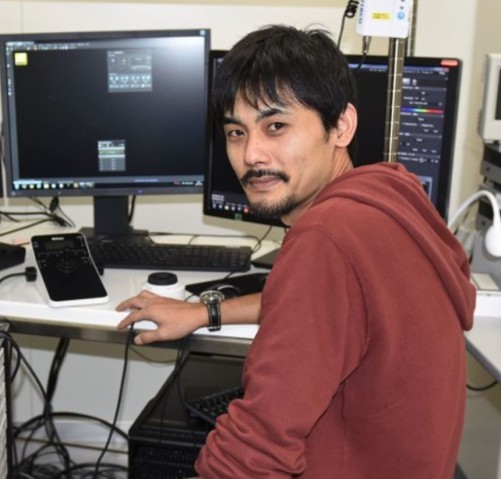 Man sitting in front of a computer