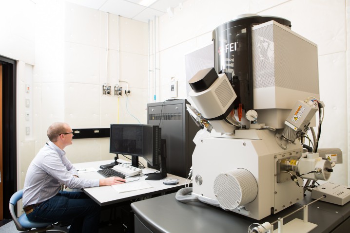 Staff operating a focused ion beam SEM 