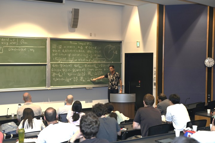 Prof. Ugur Abdulla presents a lecture on the first day of the OIST-Oxford-SLMath Summer School 2024