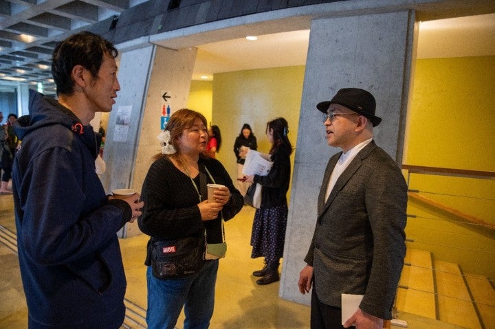 Director Sounosuke Kita chats with attendees after the event.