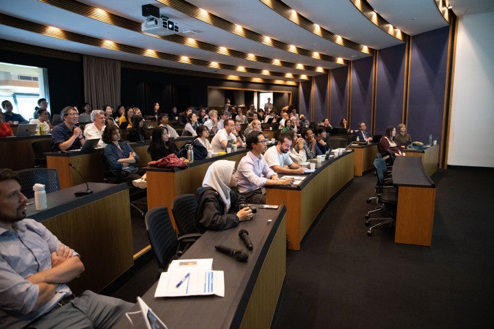 The seminar room hosts a well-attended session during the joint workshop.