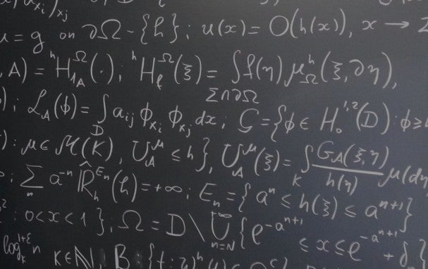 blackboard full of mathematical formulae